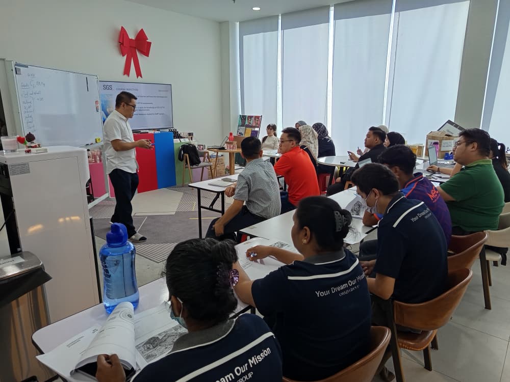 Employees learning Good Manufacturing Practices for cosmetics