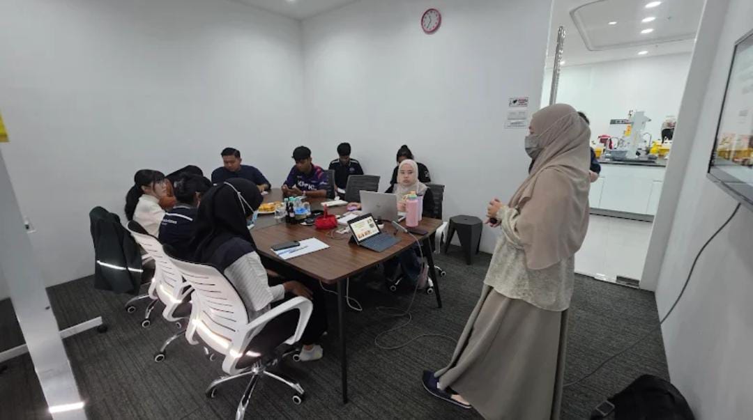 Employees learning Malaysia Halal certification requirements