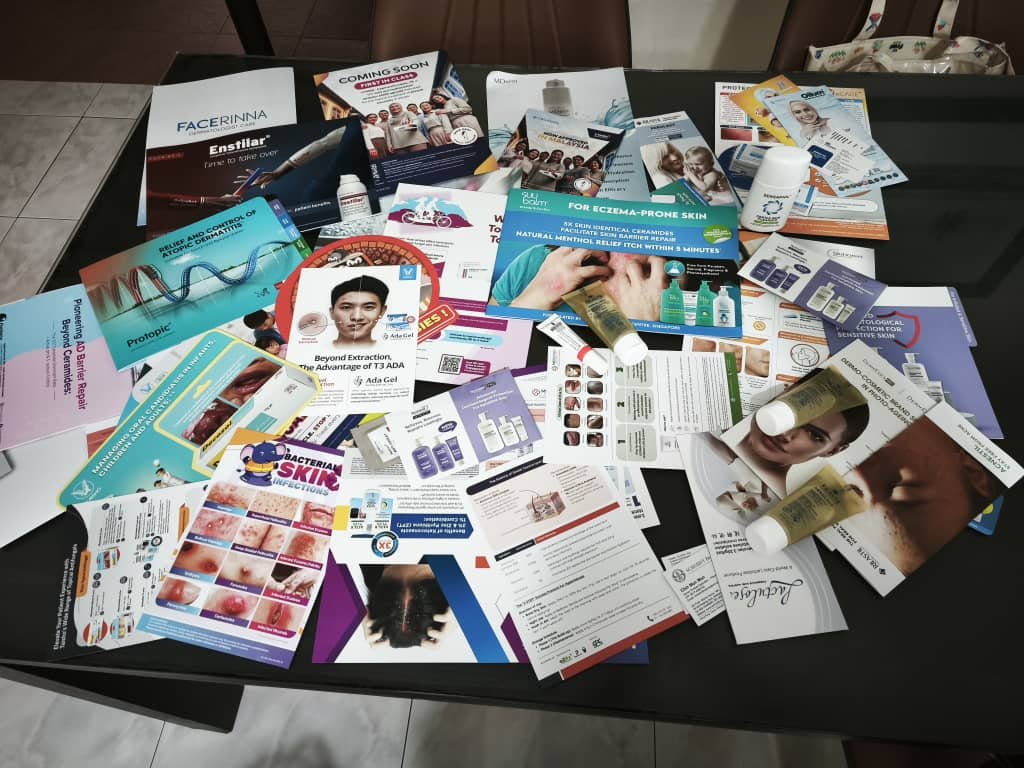 Dermatology literature and product samples collected by the ORIZI Group team at PDM ADC 2026